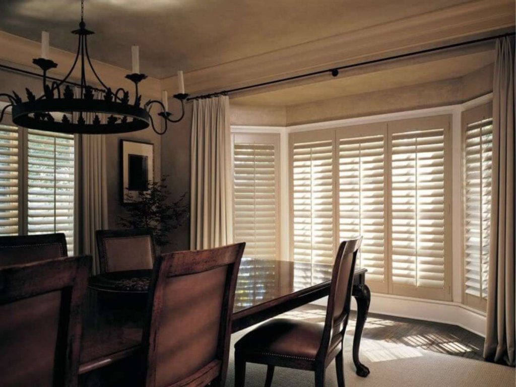 Wood shutters add elegance to a dining room setting