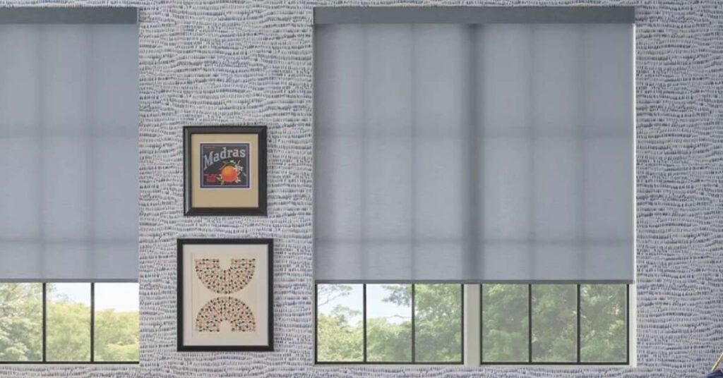 Motorized roller shades in a living room, providing privacy and light control with the touch of a button.